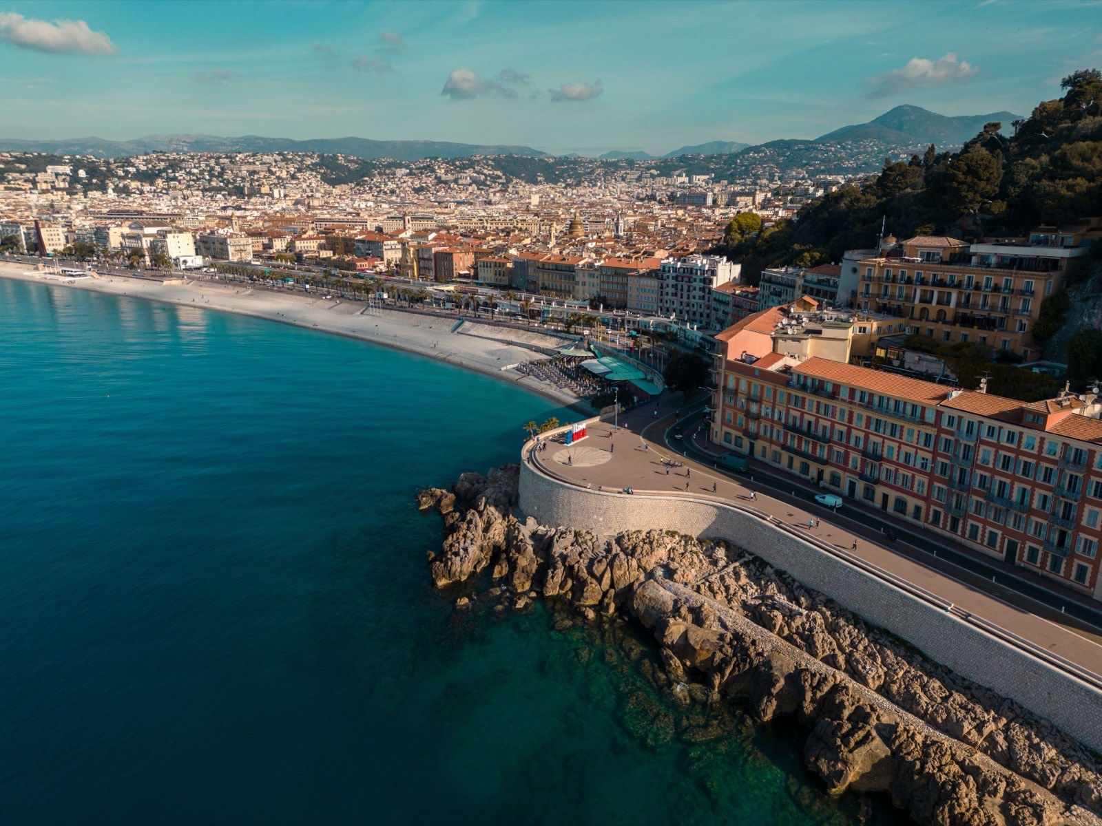 Stunning aerial view of Nice's coastal cityscape along the Mediterranean Sea.